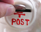 Posting coin into a donation box